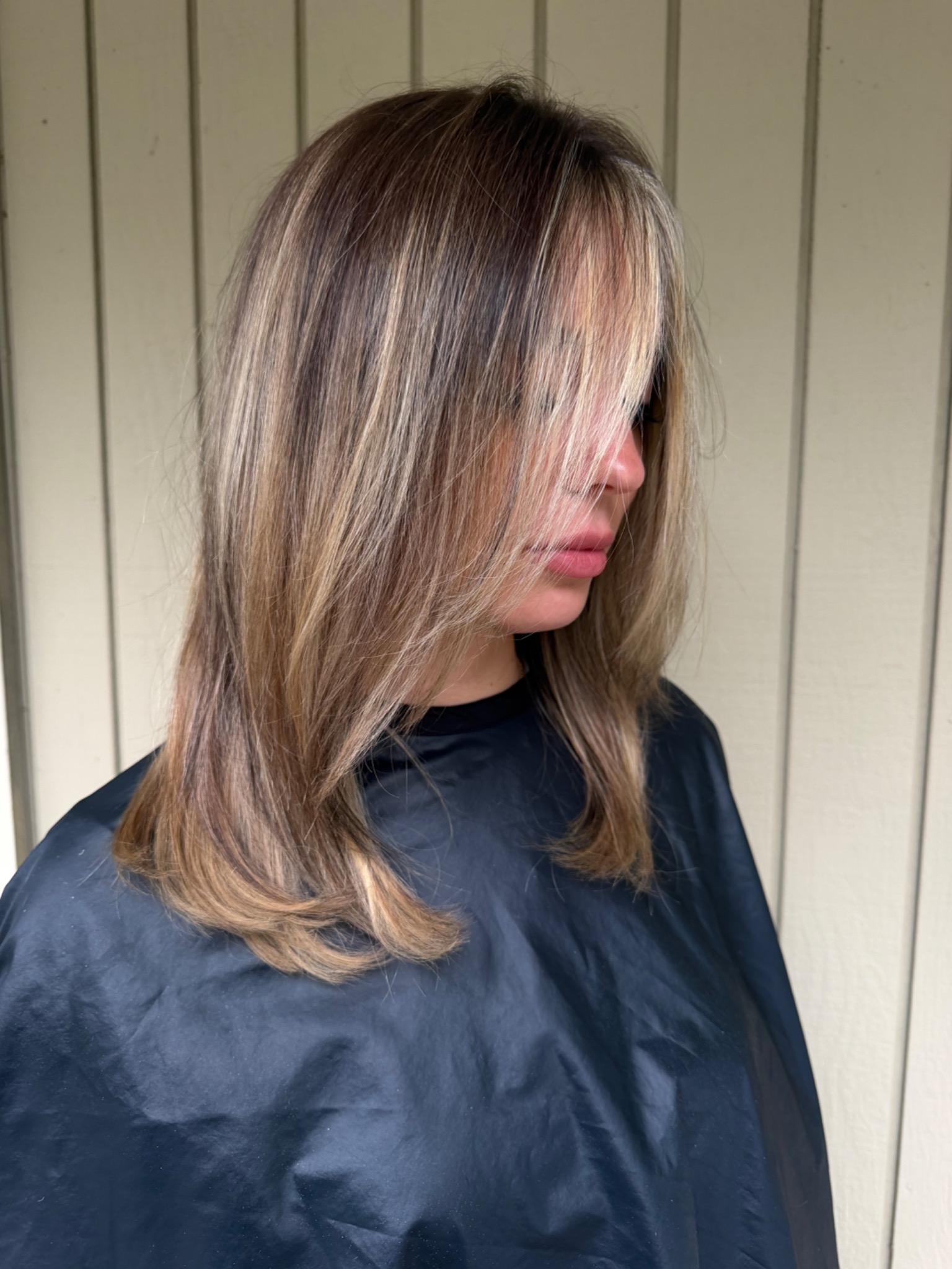 Dimensional brunette and blonde layered haircut by Hair by Maddie Rose