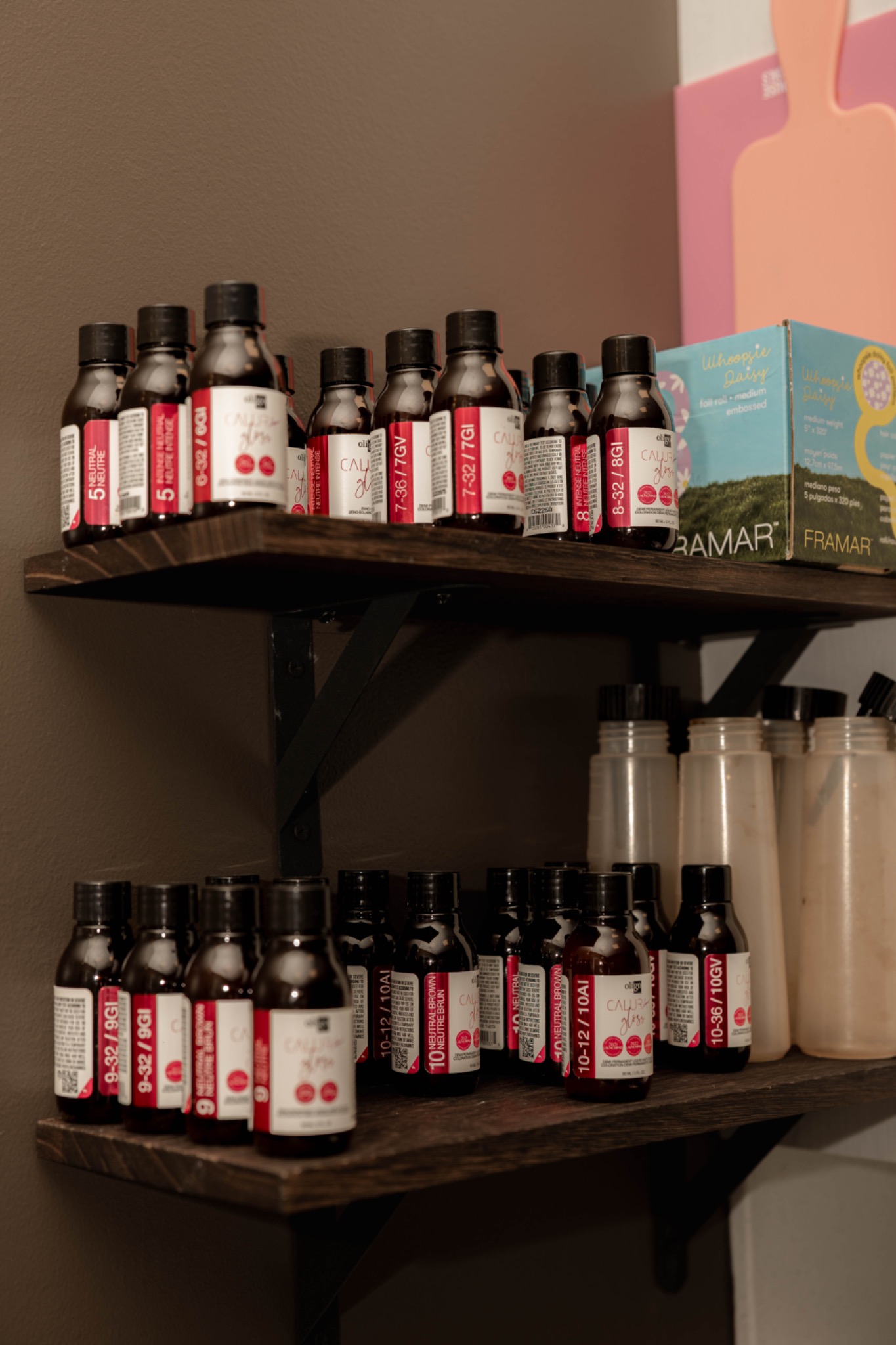 Professional hair color shelves inside Hair by Maddie Rose studio