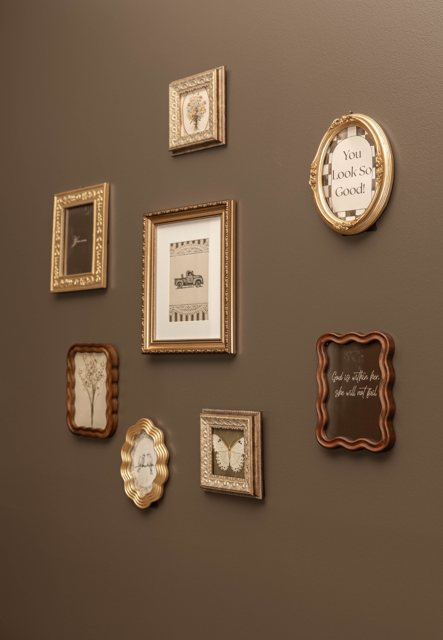 Warm vintage gallery wall decor inside Hair by Maddie Rose studio